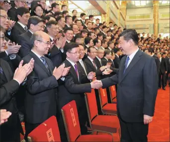  ?? JU PENG / XINHUA ?? President Xi Jinping meets space scientists and engineers involved in the research and developmen­t of the Chang’e 4 lunar mission in the Great Hall of the People in Beijing on Wednesday.