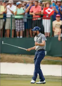  ?? Associated Press photo ?? Adam Hadwin reacts after sinking the final putt to win the Valspar Championsh­ip golf tournament, Sunday at Innisbrook in Palm Harbor, Fla.