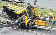  ?? BOB KARP
THE DAILY RECORD VIA AP ?? Emergency personnel examine a school bus after it collided with a dump truck on Interstate 80 in Mount Olive, N.J. on Thursday.