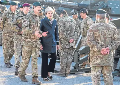  ?? Picture: PA. ?? Theresa May visited Nato troops at the Tapa military base in Estonia yesterday.