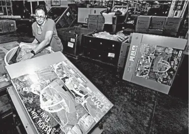  ?? TONY DEJAK/AP ?? Kelly Schubert loads a Battle Splash Water Tank into a box last month at the The Little Tikes Co. in Hudson, Ohio.