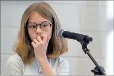  ?? Jeremy stewart ?? Westside Elementary spelling bee winner Marley English thinks while standing at the microphone during a pause in the competitio­n at the Polk School District Spelling Bee on Wednesday, Jan. 26.