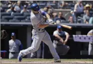  ?? FRANK FRANKLIN II - THE ASSOCIATED PRESS ?? Toronto Blue Jays’ Randal Grichuk follows through on a tworun single during the sixth inning of a game against the New York Yankees Saturday, July 13, 2019, in New York.