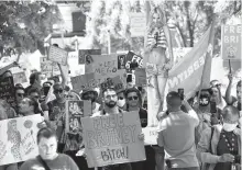  ?? AP-Yonhap ?? Britney Spears supporters march outside a court hearing concerning the pop singer’s conservato­rship at the Stanley Mosk Courthouse in Los Angeles, Calif., Wednesday.