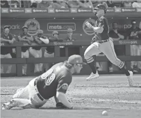  ?? JIM RASSOL/USA TODAY SPORTS ?? Detroit Tigers second baseman Jace Jung (84) scores a run on a throwing error against the New York Mets on March 10.