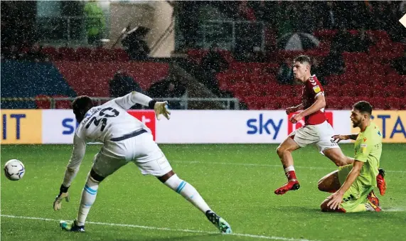  ?? Picture: Rogan Thomson/JMP ?? Alex Scott scores a goal to put Bristol City 1-0 up against Nottingham Forest at a very wet Ashton Gate last night