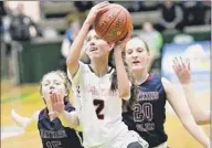  ?? Hans Pennink / Special to the Times Union ?? Cambridge’s Sophie Phillips scores in front of Watkins Glen’s Aislinn Klemann, left, and Adrienna Solomon on Saturday. Phillips finished with 24 pionts, 17 rebounds, six assists and two steals.