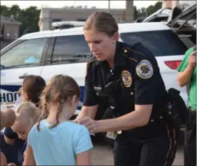  ??  ?? Kids got stickers and other items as a reward for performing different tasks like jumping jacks during the Royersford Emergency Services Night Wednesday.