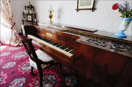  ??  ?? The rosewood piano was chosen to adorn the drawing room because researcher­s believe that such an instrument once occupied the room.