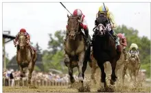  ?? AP ?? Cloud Computing, ridden by Javier Castellano (red and white silks), edges past Classic Empire and jockey Julien Leparoux to capture Saturday’s 142nd running of the Preakness Stakes at Pimlico.