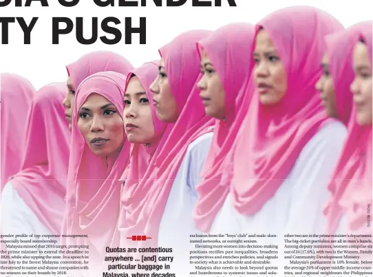  ??  ?? RIGHT Members of the United Malays National Organisati­on wait for Prime Minister Najib Razak to arrive for a party assembly at the Putra World Trade Centre in Kuala Lumpur.