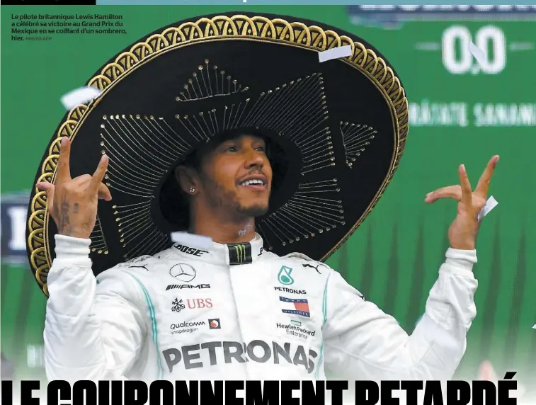  ?? PHOTO AFP ?? Le pilote britanniqu­e Lewis Hamilton a célébré sa victoire au Grand Prix du Mexique en se coiffant d’un sombrero, hier.