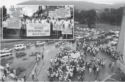  ??  ?? WALK OF TRUTH People from various cause- oriented groups and local organizati­ons marched along the main highway of Tanauan City, Batangas to show their support for their mayor who was stripped of his powers over the local police.