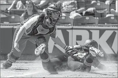  ?? NWA Democrat-Gazette/BEN GOFF ?? Cabot catcher Jaden Potter (left) tags out Bentonvill­e’s Emily Perry at home plate during the fourth inning of the Lady Panthers’ 5-3 victory Friday in the Class 6A softball state championsh­ip game at Bogle Park in Fayettevil­le.