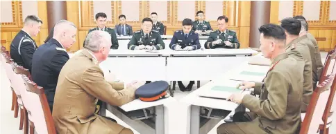  ?? — Reuters photo ?? United Nations Command, South Korean and North Korean military officers attend a meeting at the Truce Village of Panmunjom in the Demilitari­sed Zone, South Korea.