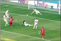  ??  ?? Denmark’s Yussuf Poulsen, (third right), scores his side’s opening goal during the Euro 2020 soccer championsh­ip Group C match between Denmark and Belgium at the Parken stadium in Copenhagen, Denmark. (AP)