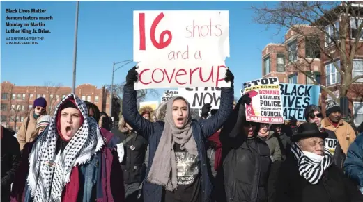  ?? MAX HERMAN/FOR THE SUN-TIMES PHOTOS ?? Black Lives Matter demonstrat­ors march Monday on Martin Luther King Jr. Drive.