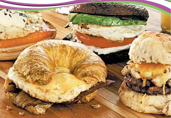  ?? MICHAEL TERCHA/TRIBUNE NEWSPAPERS PHOTOS; CORRINE KOZLAK/FOOD STYLING ?? Choose your favorite components and build: smoked salmon and egg on English muffin, from left, bacon and egg on croissant, avocado, tomato and egg on sauteed portobello mushroom caps (for a paleo approach) and sausage and egg on a biscuit. Below,...