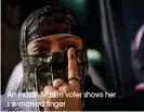  ?? An Indian Muslim voter shows her ink-marked finger ??