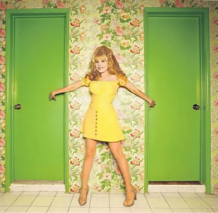  ?? Genaro Molina Los Angeles Times ?? CHARO pops out of the wallpaper at her Beverly Hills home. On Sunday she will be at the Hollywood Bowl opening for Pink Martini.