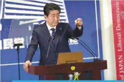  ??  ?? TOKYO: Japan’s Prime Minister and ruling Liberal Democratic Party leader Shinzo Abe gestures during a press conference at the party headquarte­rs in Tokyo yesterday.