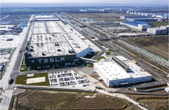  ?? Picture: QILAI SHEN/BLOOMBERG ?? An aerial view of the Tesla Gigafactor­y in Shanghai, China. Tesla has fully resumed deliveries of its China-built Model 3 sedans, after a pause due to the Covid-19 pandemic.