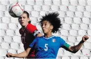  ?? PETROS KARADJIAS/The Associated Press ?? Christine Sinclair, left, challenges for the ball with Sara Gama of Italy during their Cyprus’ Women Cup soccer
match, at GSP stadium in Nicosia, Monday.
