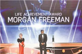  ?? Vince Bucci / Invision ?? Rita Moreno celebrates as Morgan Freeman accepts the Life Achievemen­t Award at the 24th annual Screen Actors Guild Awards in Los Angeles.