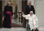  ?? GREGORIO BORGIA — THE ASSOCIATED PRESS ?? Pope Francis arrives in a wheelchair in the Paul VI hall to attend an audience with pilgrims from central Italy at the Vatican on Saturday.