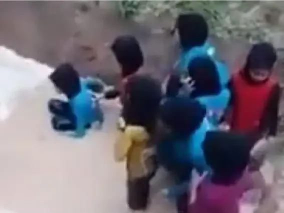  ??  ?? The children, aged between 10 and 12, huddle in a muddy pit, avoiding a snake