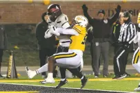  ?? L.G. PATTERSON/ASSOCIATED PRESS ?? New Mexico State running back Star Thomas, left, scores a touchdown past Missouri defensive lineman Arden Walker during Saturday’s game in Columbia, Mo.