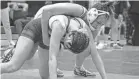  ?? FRANK DIRENNA/COLUMBUS DISPATCH ?? Central Crossing’s Addison Rudolph controls Chesapeake’s Laila Wentz during their title match at 120 pounds in the regional tournament Sunday at Olentangy Orange. Rudolph won by pin in the second period.