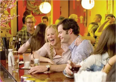  ??  ?? Schumer and Bill Hader in the romantic-comedy Trainwreck (2015).