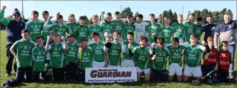  ??  ?? The triumphant Naomh Eanna squad with their mentors.