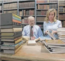  ?? | MARY ALTAFFER/ AP ?? Fred Bass sorts out a batch of used books with daughter Nancy Bass Wyden at Strand bookstore in New York. Fred Bass took over the business fromhis father.