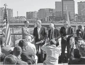  ?? VIVIAN JONES/NASHVILLE TENNESSEAN ?? Nashville Mayor Freddie O'connell shakes hands with Tennessee Gov. Bill Lee after a ribbon cutting to celebrate the reopening of Broadway Bridge in downtown Nashville on Oct. 18, 2023.