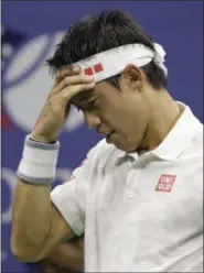  ?? DARRON CUMMINGS — THE ASSOCIATED PRESS FILE ?? In this file photo, Kei Nishikori, of Japan, adjusts his head band between serves to Stan Wawrinka, of Switzerlan­d, during the semifinals of the U.S. Open tennis tournament, in New York. Nishikori is the latest top player to pull out of the U.S. Open...