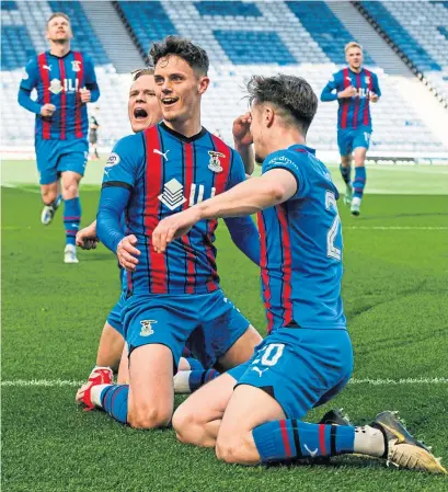  ?? ?? Inverness winger Cameron Harper (centre) savours his first-half strike that sealed victory for Inverness.