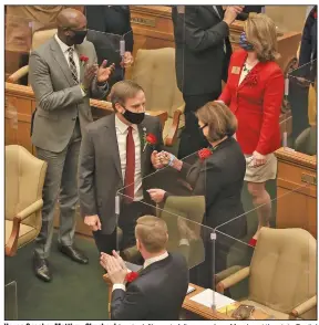  ?? (Arkansas Democrat-Gazette/Staton Breidentha­l) ?? House Speaker Matthew Shepherd (center left) greets fellow members Monday at the state Capitol in Little Rock as he arrives to be sworn in on the first day of the legislativ­e session.