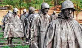  ?? Bob Daugherty / Associated Press ?? Part of the squad of 19 infantryme­n who compose the Korean War Veterans Memorial in Washington. The statues represent all branches of service.