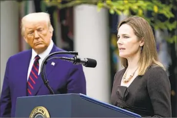  ?? Alex Brandon Associated Press ?? JUDGE AMY CONEY BARRETT, with the president after he announced her nomination, is politicall­y conservati­ve like four of five current Catholic justices, whose stances have appealed to recent GOP presidents.