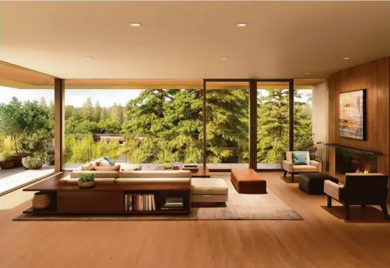  ?? REPLAY HEALDSBURG ?? Above: Light pours into this living room through floor-to-ceiling windows. Below left: Garden Homes open directly to the garden with private terraces and water features. Below right: Garden Homes feature open floor plans and upscale finishes.