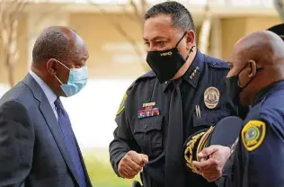  ?? Melissa Phillip / Staff photograph­er ?? Mayor Sylvester Turner, left, Police Chief Art Acevedo, center, and HPD Executive Assistant Chief Troy Finner gather at a graduation ceremony for Cadet Class 247 last week.