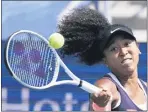  ?? FRANK FRANKLIN II — THE ASSOCIATED PRESS ?? Naomi Osaka returns a shot from Elise Mertens at the Western & Southern Open in New York.