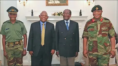  ?? ZIMBABWE BROADCASTI­NG CORPORATIO­N VIA AFP ?? Zimbabwe President Robert Mugabe (second from right) poses with Zimbabwe Defense Forces Commander General Constantin­o Chiwenga (right) and South African envoys at the presidenti­al residence on Thursday in Harare.