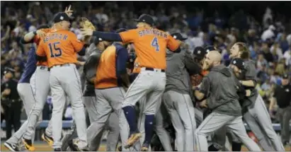  ?? ASSOCIATED PRESS ?? The Houston Astros celebrate after winning Game 7 of the World Series against the Los Angeles Dodgers. Make no mistake, this is not the same game many fans came to know and love.