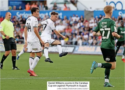  ?? CHRIS FAIRWEATHE­R/HUW EVANS AGENCY ?? Daniel Williams scores in the Carabao Cup win against Plymouth in August.