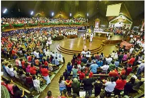  ??  ?? Packed: A bird’s eye view of the large crowd at the Sacred Heart Cathedral in Sibu during Christmas Day mass.