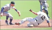  ?? DOUG DURAN — BAY AREA NEWS GROUP ?? The Rockies’ Trevor Story (27) makes the late tag as the Giants’ Alex Dickerson slides into second base safely on a double in the first inning on Thursday in San Francisco.