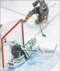  ?? Jason Franson The Associated Press ?? Tomas Nosek finishes off a nifty passing play to beat Dallas goalie Anton Khudobin in the Knights’ Game 2 triumph.